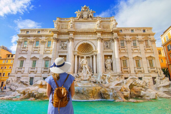 woman in front of trevi fountain