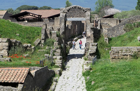 =Pompeii ruins people walking